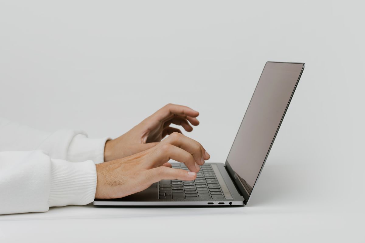 Person searching for AI tools on a laptop